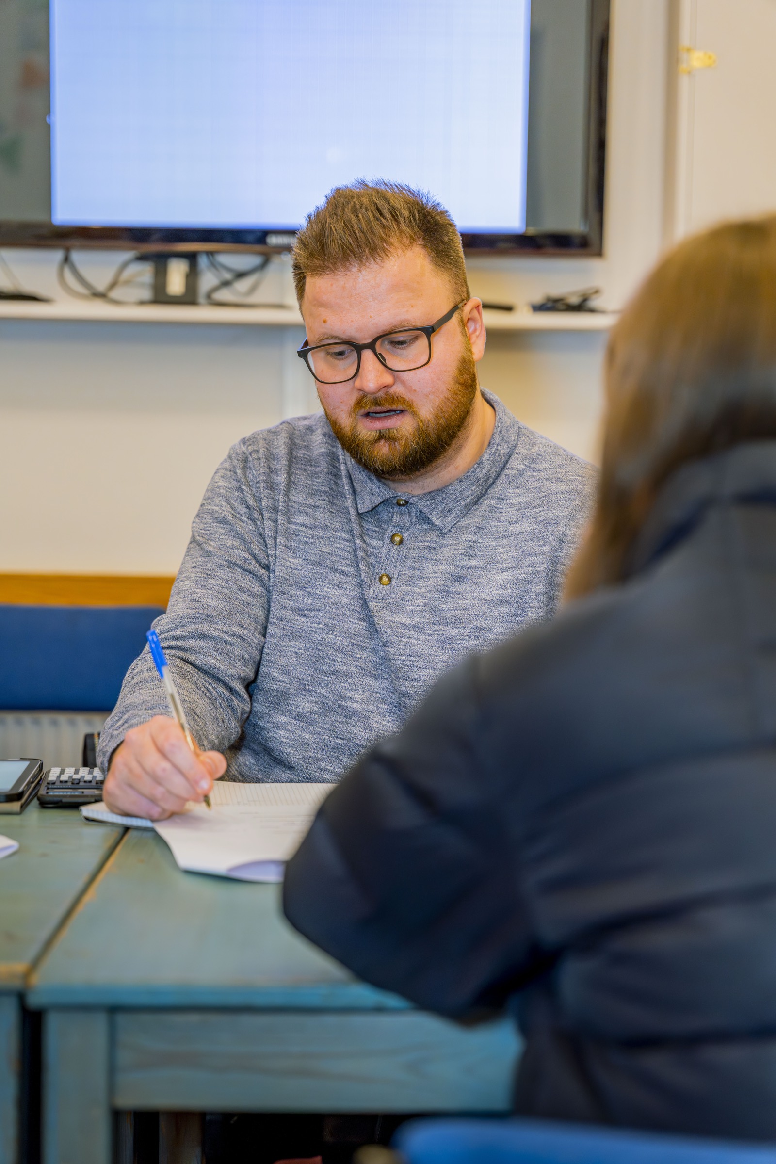 A Restart Tuition tutor working one-to-one with a student