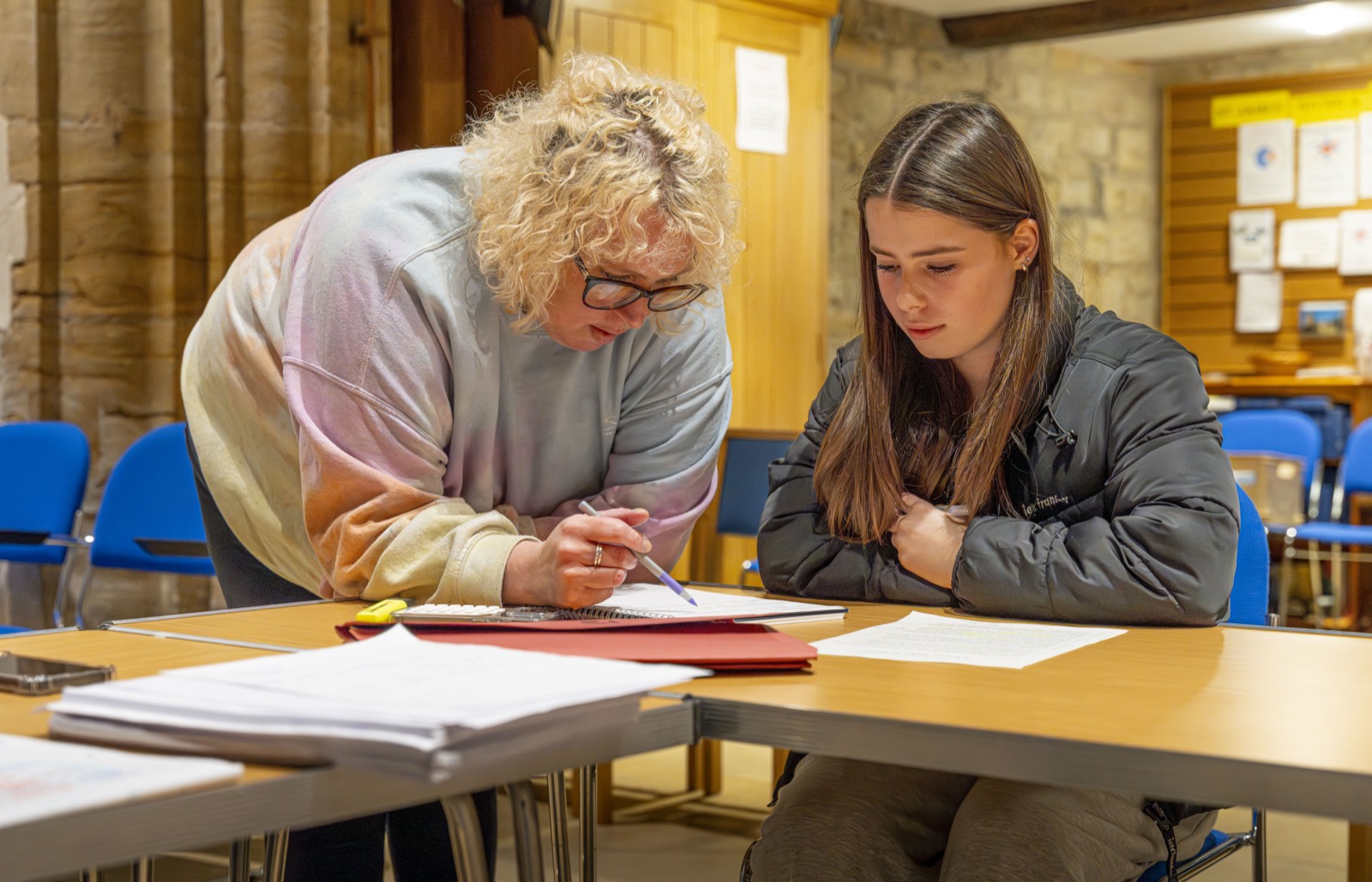 A Restart Tuition tutor giving one-to-one support to a student